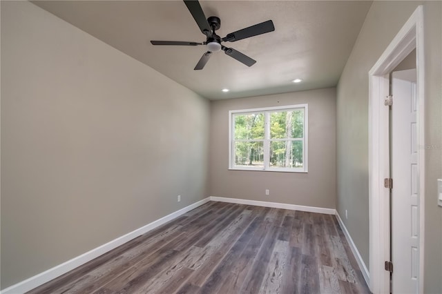 spare room featuring hardwood / wood-style floors and ceiling fan