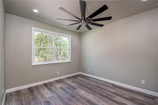 spare room featuring hardwood / wood-style flooring and ceiling fan