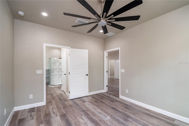 unfurnished bedroom featuring light wood-type flooring and ceiling fan