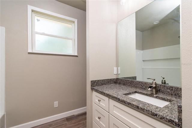 bathroom with hardwood / wood-style floors and vanity