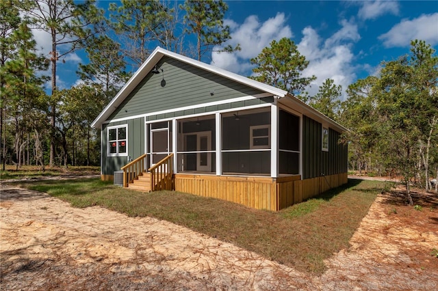 view of front of house featuring a sunroom