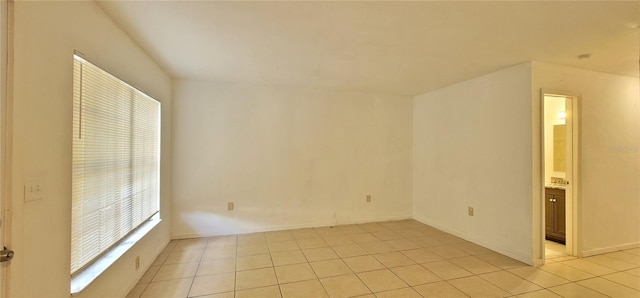 empty room with light tile patterned floors