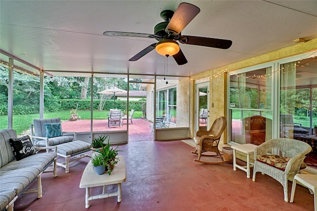 sunroom / solarium with ceiling fan