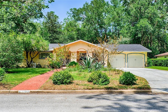 ranch-style house featuring a front lawn and a garage