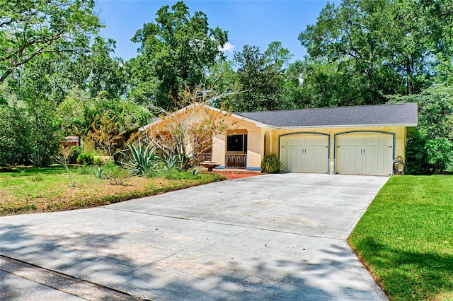 ranch-style home with a front lawn and a garage