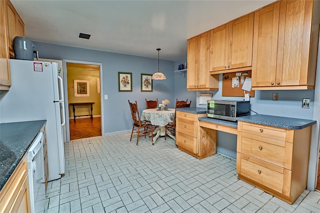 kitchen with pendant lighting and white appliances