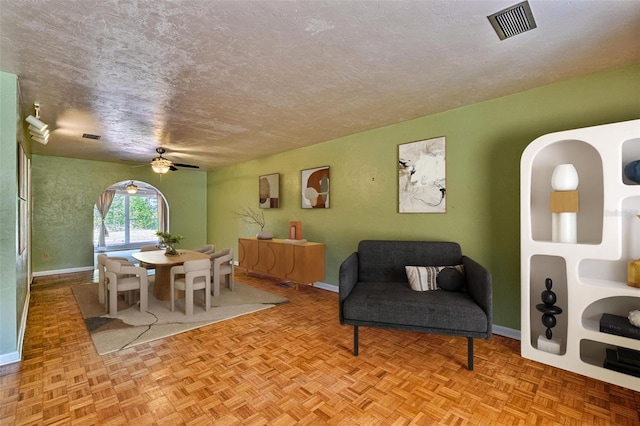 4700 NW 19th Pl, Gainesville, FL 32605 - interior space with visible vents, a textured ceiling, baseboards, and ceiling fan
