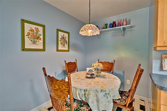 4700 NW 19th Pl, Gainesville, FL 32605 - dining room with light tile patterned floors and baseboards