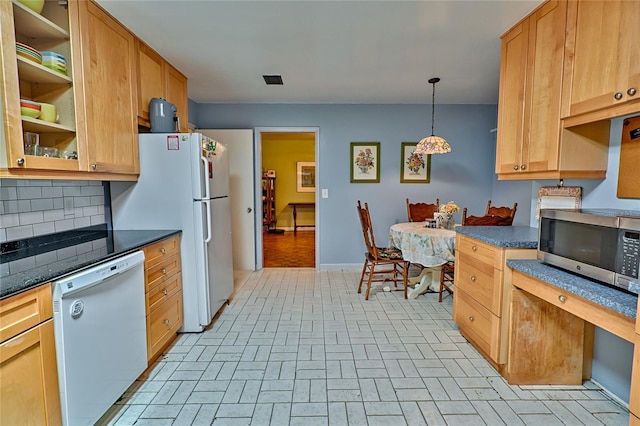 4700 NW 19th Pl, Gainesville, FL 32605 - kitchen featuring white appliances, baseboards, backsplash, and dark countertops