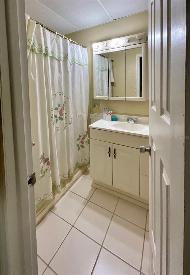 bathroom with vanity and tile patterned flooring