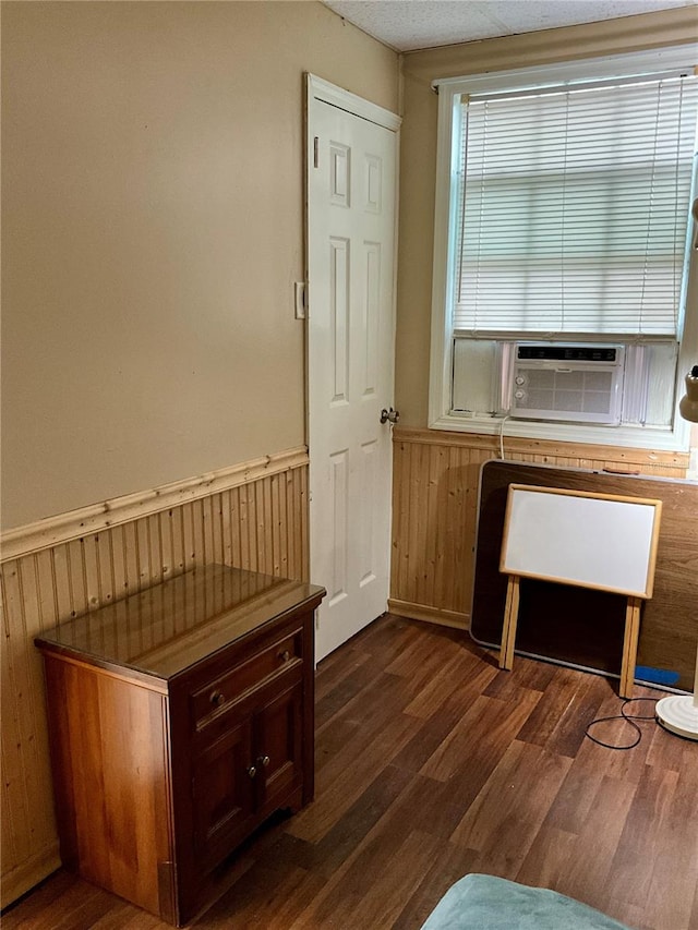 interior space featuring cooling unit and dark hardwood / wood-style floors