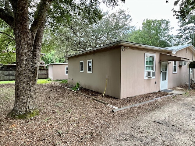 view of side of property with cooling unit