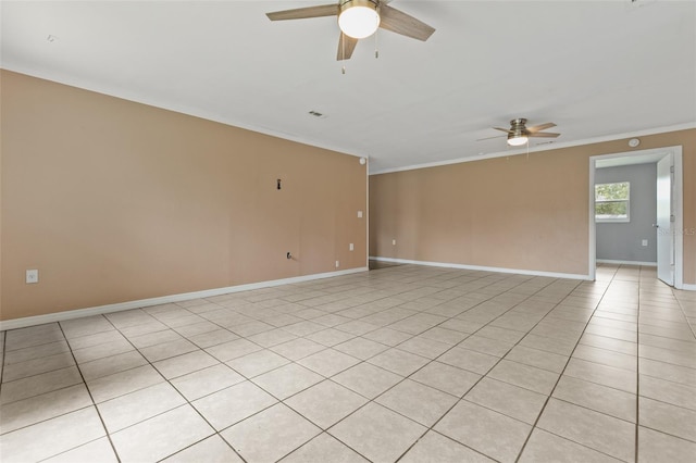 tiled spare room with crown molding and ceiling fan