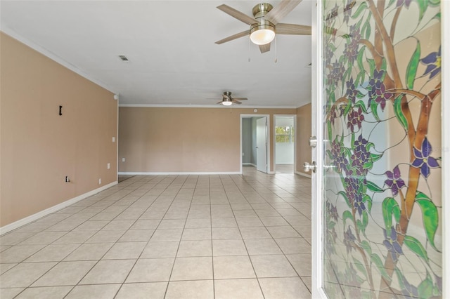 tiled spare room with ceiling fan and ornamental molding