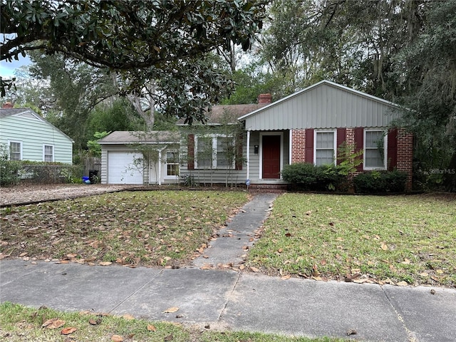 ranch-style home with a front yard and a garage