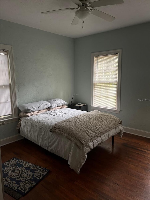 bedroom featuring ceiling fan and hardwood / wood-style flooring