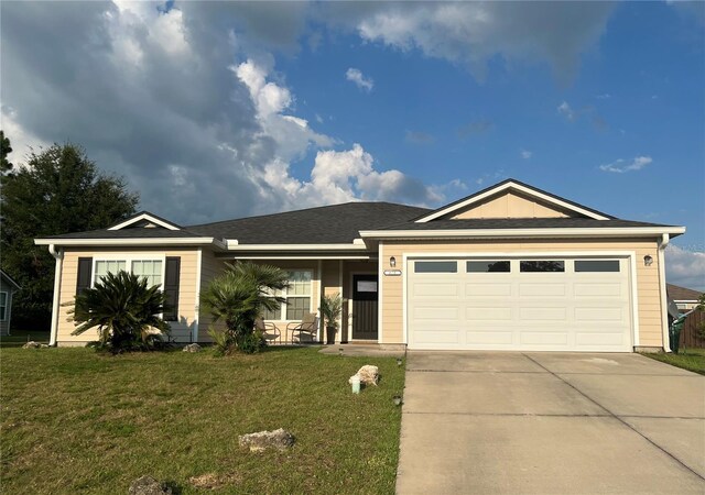 ranch-style home with a front yard and a garage