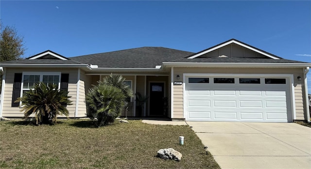 ranch-style home featuring board and batten siding, a garage, a front lawn, and concrete driveway