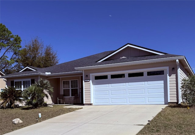 ranch-style house with a garage, concrete driveway, and board and batten siding