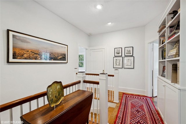 corridor with light hardwood / wood-style flooring