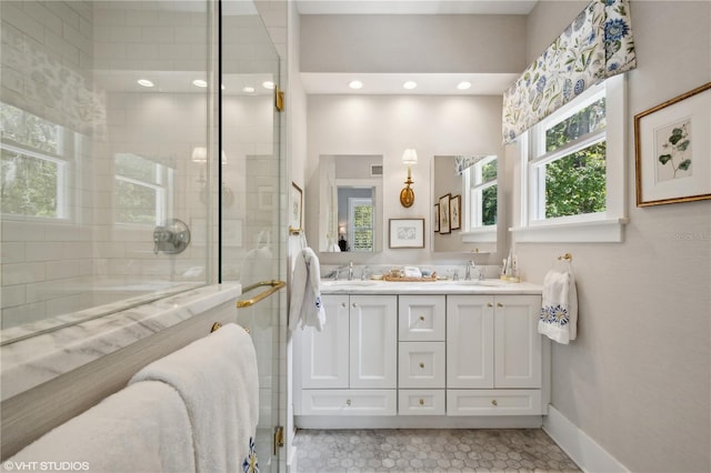 bathroom featuring vanity and a shower with shower door