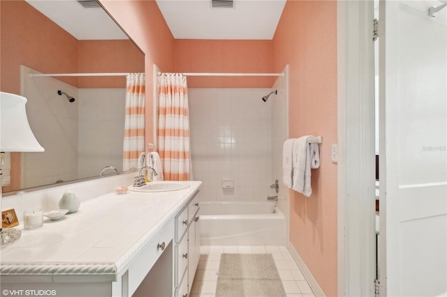 bathroom with tile patterned flooring, vanity, and shower / bath combo with shower curtain