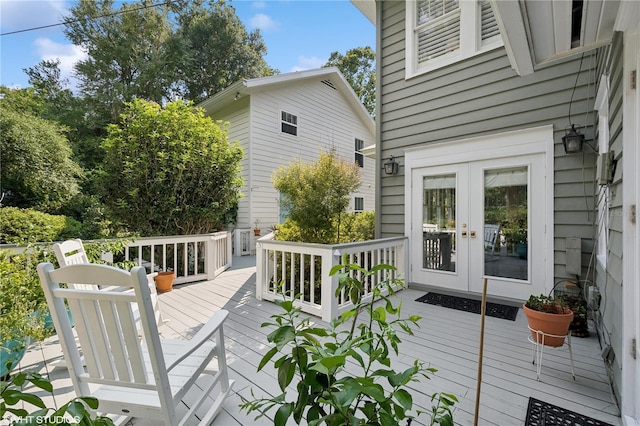 wooden deck featuring french doors