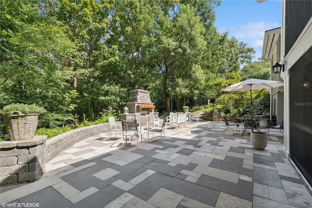 view of patio / terrace with exterior fireplace