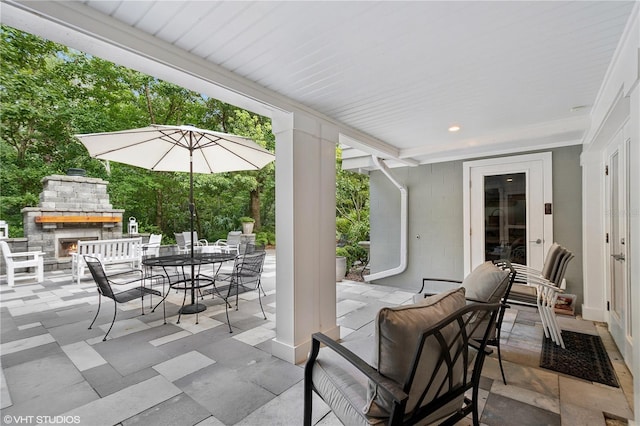 view of patio / terrace with an outdoor stone fireplace