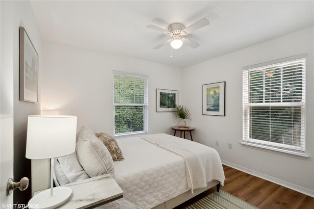 bedroom with ceiling fan and wood-type flooring