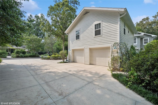 view of property exterior with a garage