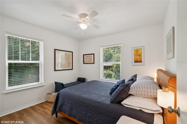 bedroom featuring hardwood / wood-style flooring and ceiling fan