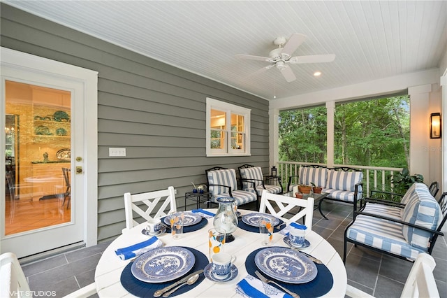 sunroom / solarium with ceiling fan