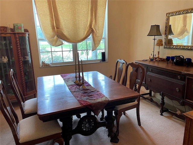 dining space with carpet