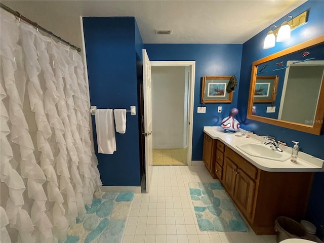 bathroom featuring tile patterned flooring and vanity