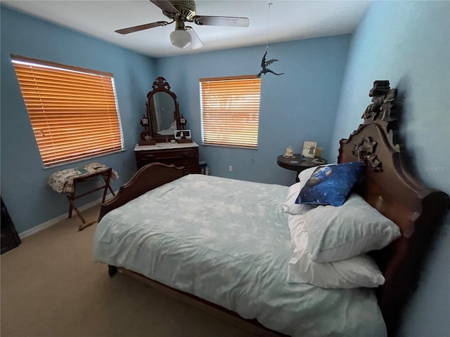 bedroom with ceiling fan and carpet floors