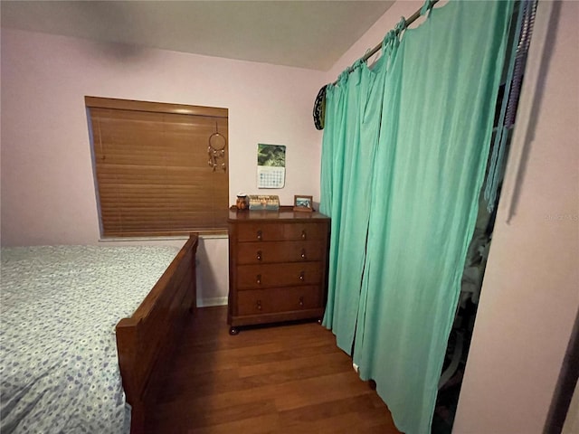 bedroom featuring dark hardwood / wood-style floors