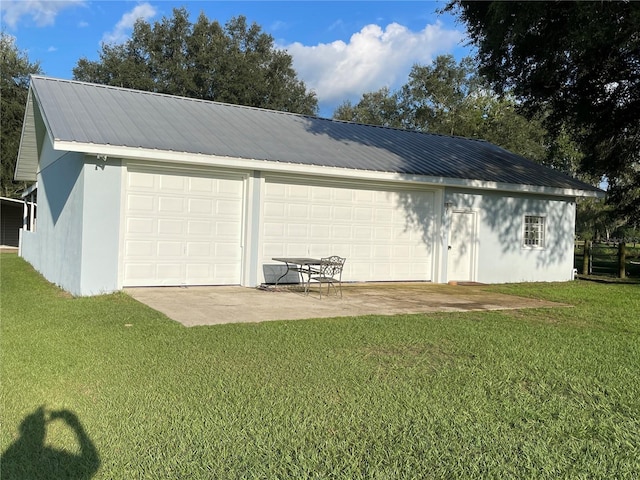 garage with a yard