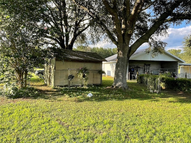 rear view of house featuring a yard