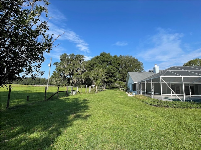 view of yard featuring a lanai