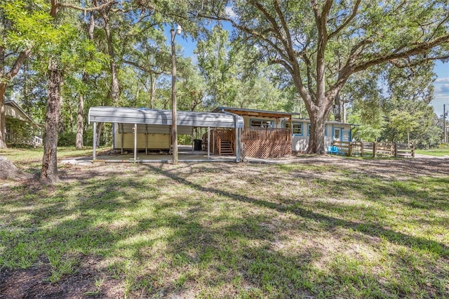 view of yard with a carport