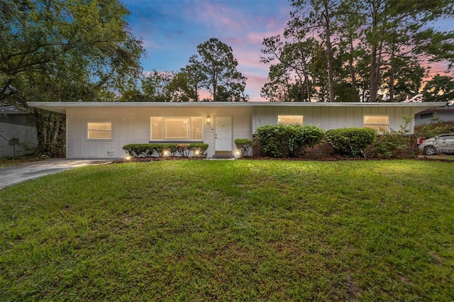 ranch-style home featuring a front yard