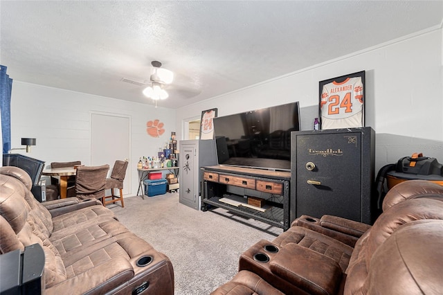 living area with concrete block wall, visible vents, ceiling fan, a textured ceiling, and carpet floors