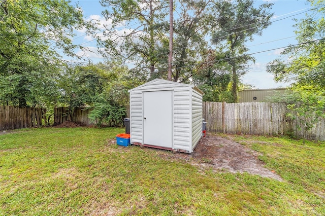 view of shed featuring a fenced backyard