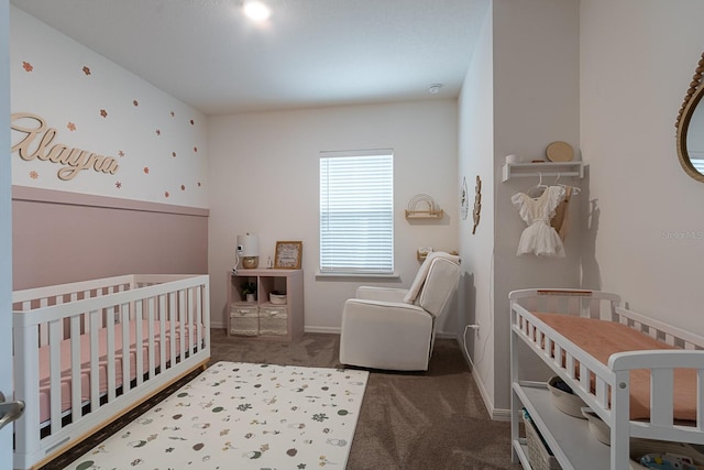 bedroom featuring a crib and carpet floors