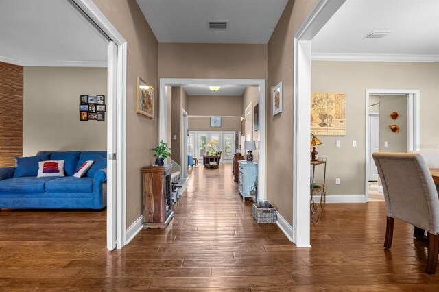 hall featuring crown molding and wood-type flooring