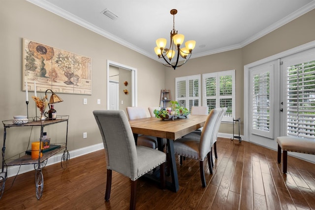 dining space with ornamental molding, dark hardwood / wood-style floors, and a chandelier