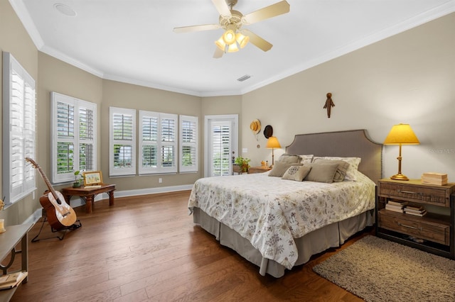 bedroom with ceiling fan, crown molding, and wood-type flooring