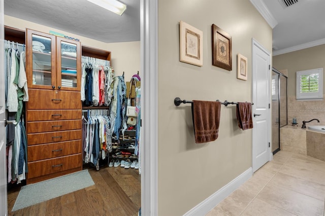 walk in closet featuring light tile patterned floors