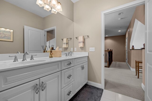 bathroom with dual vanity and tile patterned floors